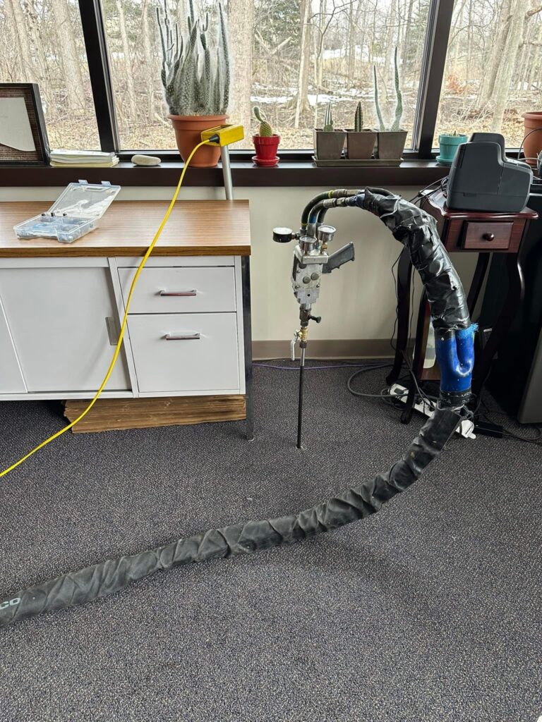 Interior concrete leveling taking place inside of an office